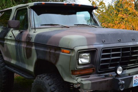 1989 Ford Bronco - This 1978 Ford Bronco features a camouflage paint scheme and is equipped for off-road use with large tires and a heavy-duty bumper.