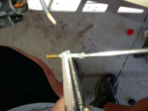 1994 Ford Bronco - A person is using pliers to adjust a throttle body linkage, with a SuperMotors.net watermark visible.