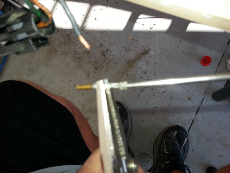 Close-up of throttle body part with wires and tool