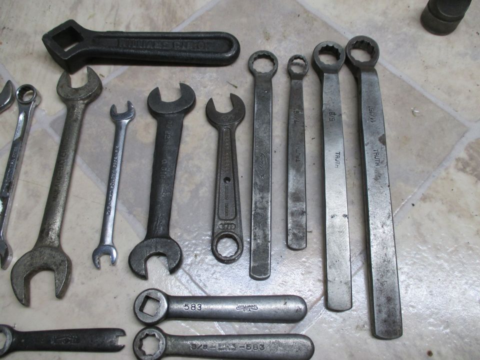 Collection of various wrenches, including a large black one with "WILLIAMS SUPERRENCH" visible