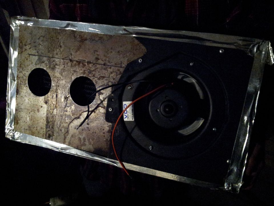 Speaker with two holes and wires, taped edges
