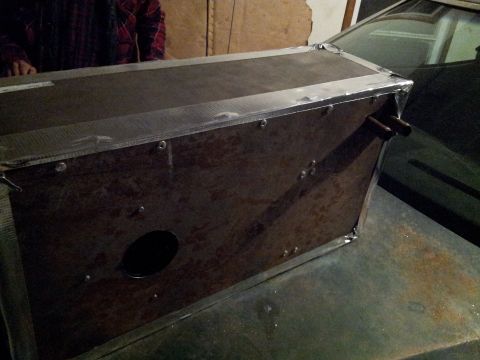 1973 Ford Ranchero - A custom metal box is placed on the hood of a car, obscuring the vehicle's details.