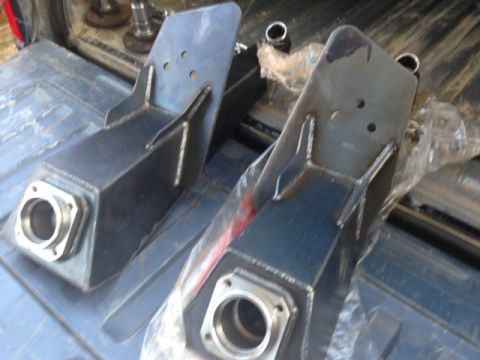 1986 Ford Bronco - Two custom fabricated trailing arms are shown, likely for an off-road vehicle modification.