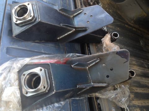 1986 Ford Bronco - Two custom steel trailing arms are shown, likely for an off-road vehicle modification.