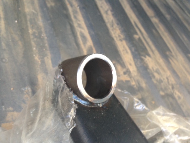Close-up of a metal tube with a plastic wrap