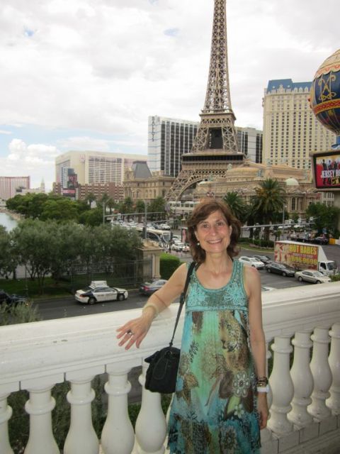1991 Ford LTD Crown Victoria - Woman enjoys the view of the Las Vegas Strip, with a replica of the Eiffel Tower prominent in the background.