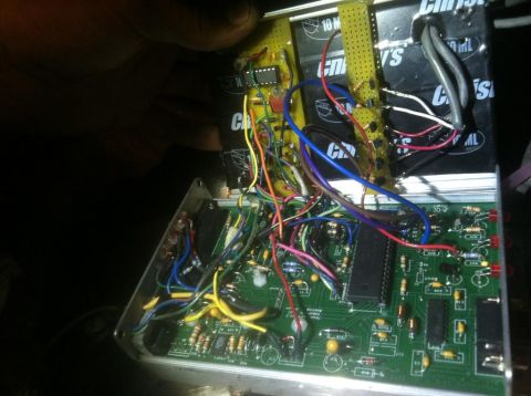1995 Ford Probe - A close-up view of an electronic circuit board with numerous wires and integrated circuits, showing some readable text on components.