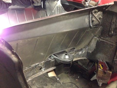 1964 Ford Fairlane - Metal floor pan repair in progress, focusing on structural elements and welding details.
