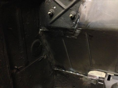 1964 Ford Fairlane - The underside of a vehicle, revealing structural components and recent welding work.