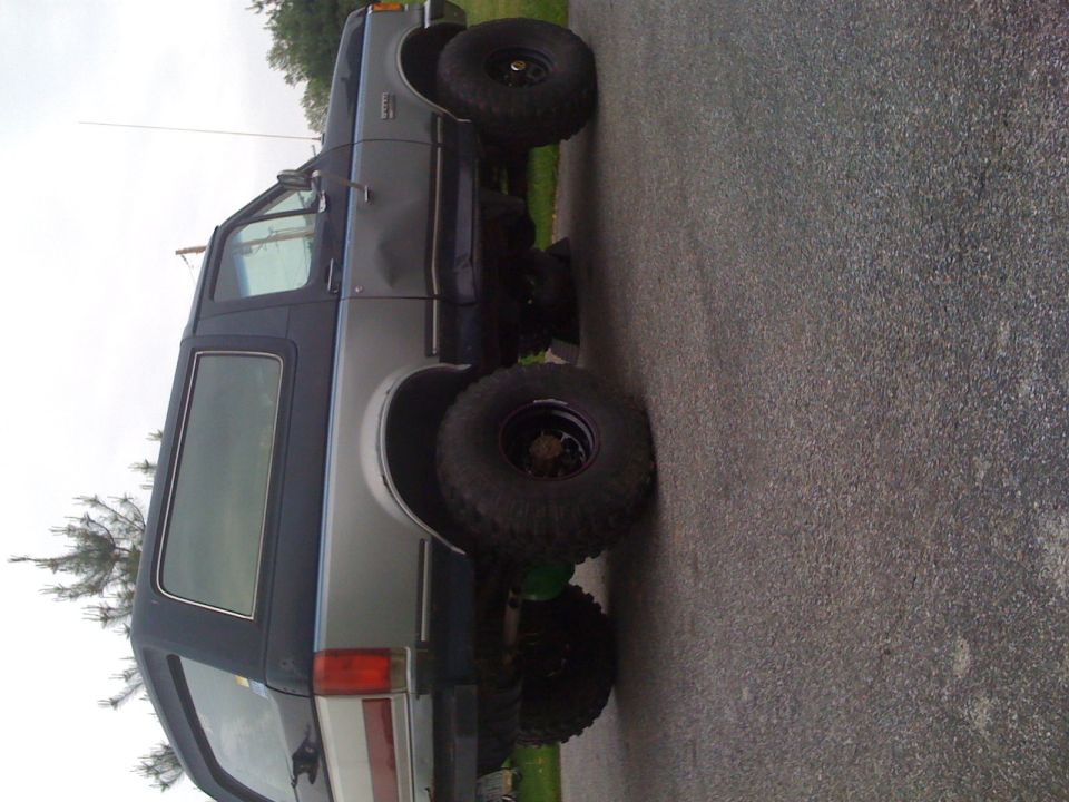 1989 Ford Bronco side view, lifted with large tires