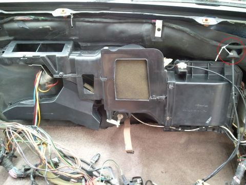 1994 Ford Bronco - Disassembled HVAC unit with numerous wires and cables visible, indicating interior work.