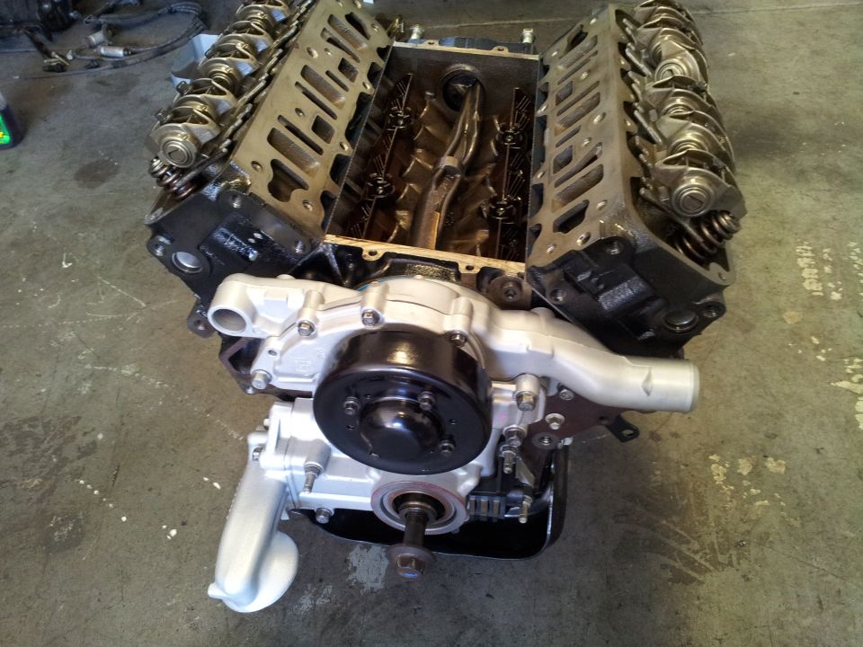 V8 engine block with water pump and pulley assembly