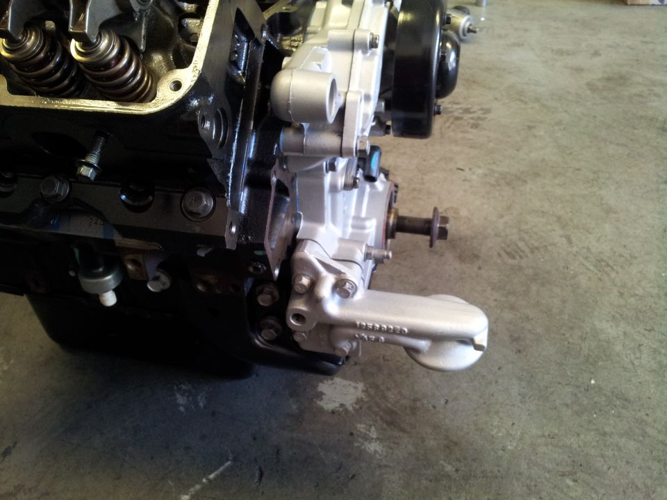 Close-up of an engine block with oil pan and some internal components visible