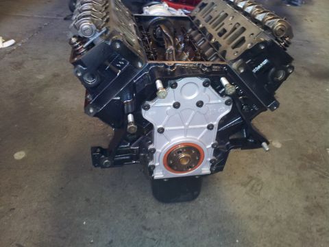 2001 Chevrolet Impala - Engine block assembly with front timing cover removed, revealing internal components.