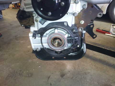 2001 Chevrolet Impala - Close-up view of an engine block, focusing on the crankshaft pulley assembly and associated sensors.