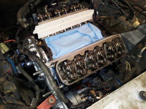 2001 Chevrolet Impala - Engine work in progress, valve train components are visible after removing the valve covers.