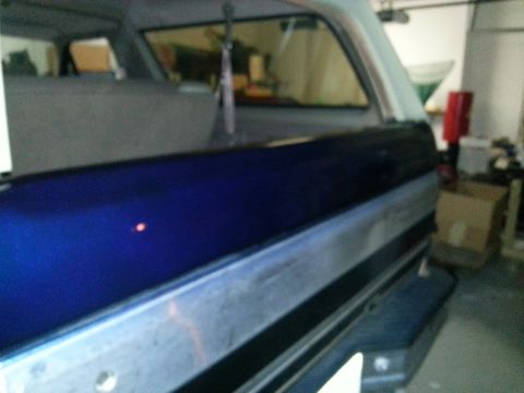 1994 Ford Bronco - Rear view of a 1994 Ford Bronco, showing its distinctive two-tone paint scheme.