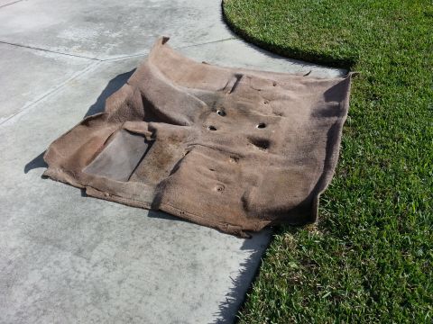 1994 Ford Bronco - This is a removed car floor carpet, possibly needing replacement or cleaning.