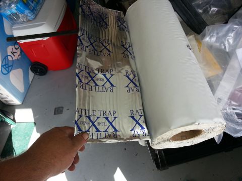 1994 Ford Bronco - Sound deadening material and a roll of white material are shown.