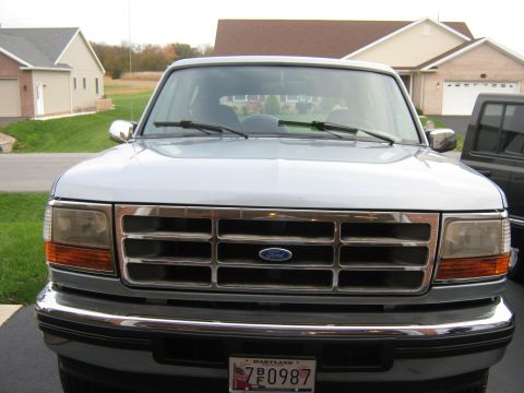 1996 Ford Bronco - Front view of a 1996 Ford Bronco with a chrome grille and Ford emblem.