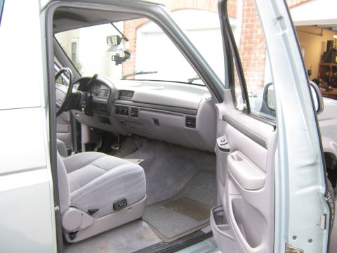 1996 Ford Bronco - Interior view of a 1996 Ford Bronco, highlighting the dashboard and seating.