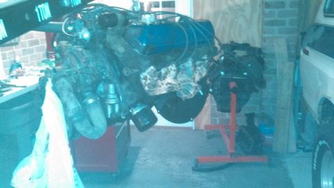 1979 Ford Bronco - Engine removed from vehicle and placed on an engine stand for repair or rebuilding.