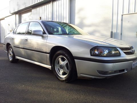 2001 Chevrolet Impala - A silver 2001 Chevrolet Impala is shown from the front three-quarter view.