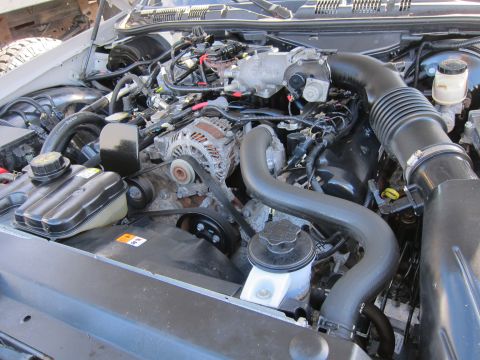 2001 Ford Crown Victoria - The engine compartment of a 2001 Ford Crown Victoria is shown with various components visible.
