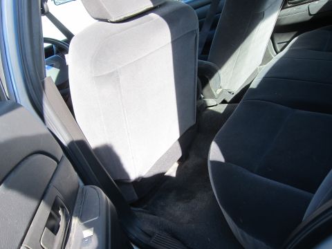 2001 Ford Crown Victoria - Interior view of a car showing the front and rear seats.