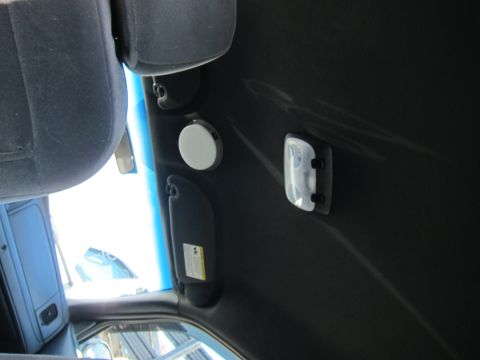2001 Ford Crown Victoria - Interior view of car ceiling showing sun visors and dome light.