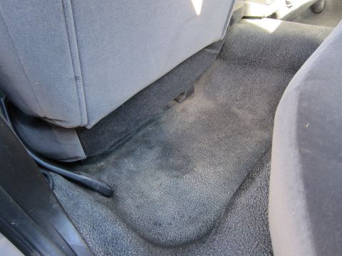 2001 Ford Crown Victoria - The textured floor and lower portion of the seats are visible in this interior shot.