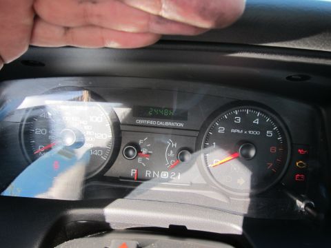 2001 Ford Crown Victoria - Interior view of a vehicle's dashboard gauges, including a digital odometer displaying 2448 hours.