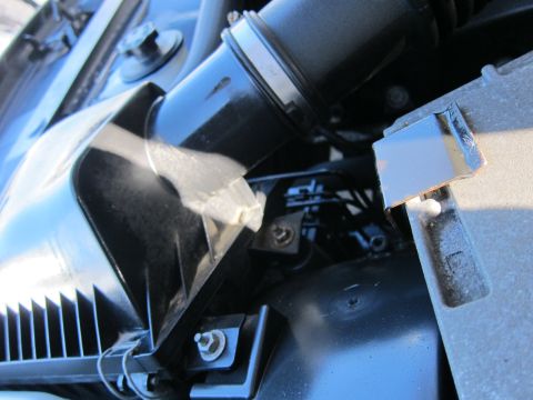 2001 Ford Crown Victoria - Close-up view of a vehicle's engine air intake system components.