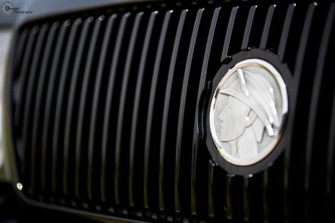 2003 Mercury Marauder - Close-up of a black grille the Mercury emblem, with a watermark at the bottom right.