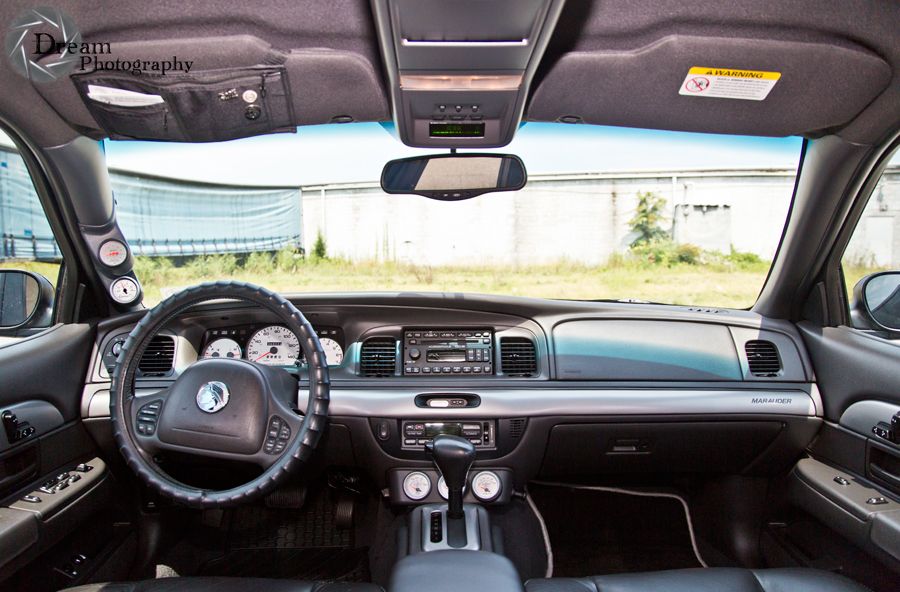 2003 Mercury Marauder interior showing dashboard, steering wheel, and aftermarket gauges