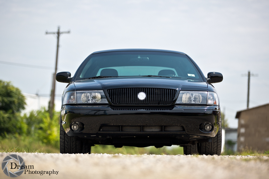 Front view of a black 2003 Mercury Marauder parked on a gravel road