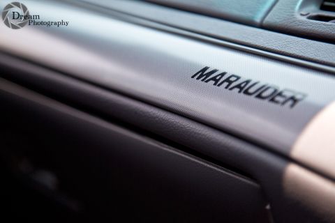 2003 Mercury Marauder - Close-up of the "Marauder" badging on the interior trim of a 2003 Mercury Marauder.