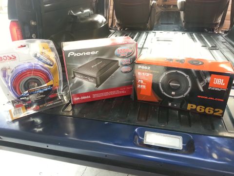 1994 Ford Bronco - Car audio equipment, including Pioneer amplifier and JBL speakers, is laid out in the cargo area of a vehicle.
