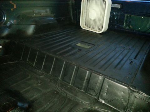 1994 Ford Bronco - Vehicle interior with a fan, likely being dried or aired out.