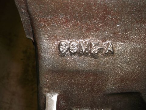 1967 Ford Mustang - Close-up of a cast iron engine part showing the casting number C8VE-A.