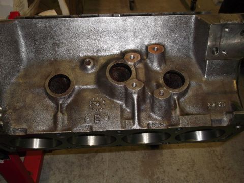 1967 Ford Mustang - Engine block casting with visible cylinder bores and some stamped markings.