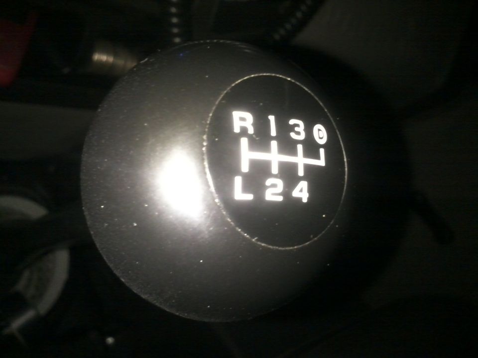 Black manual transmission shift knob with R, 1, 3, 0, L, 2, 4 markings