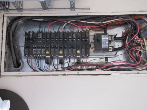 1995 Ford Bronco - An electrical panel with numerous circuit breakers and a complex network of wires.