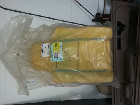 1994 Ford Bronco - Unused seat cushion, still in original packaging, with a visible Ford part number label.