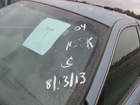 2001 Ford Crown Victoria - White markings and a paper tag are visible on the car's windshield.