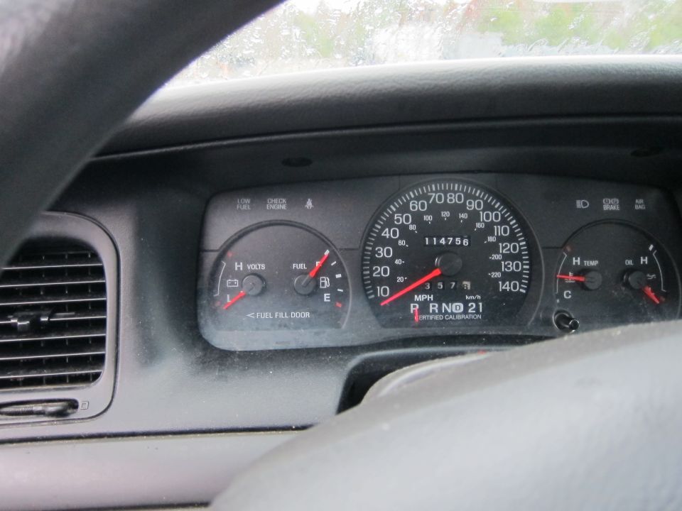 2001 Ford Crown Victoria dashboard gauges showing 114756 miles