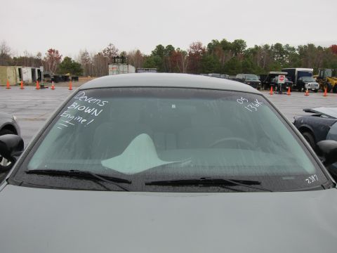2001 Ford Crown Victoria - Windshield view of a police car with handwritten notes indicating a blown engine and mileage.