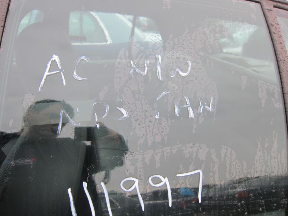 writing on car window says AC NW NPS CHW 11 1997