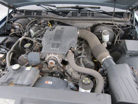 2001 Ford Crown Victoria - Engine bay of a vehicle, showing the V8 engine components and associated plumbing.