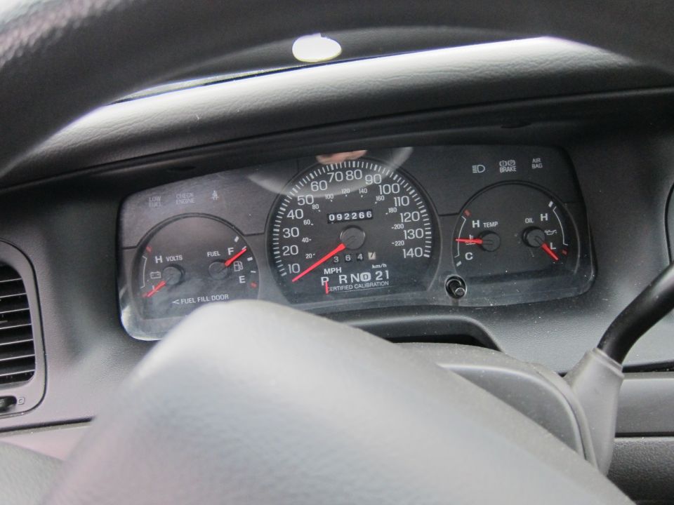 2001 Ford Crown Victoria dashboard gauges showing 92,266 miles